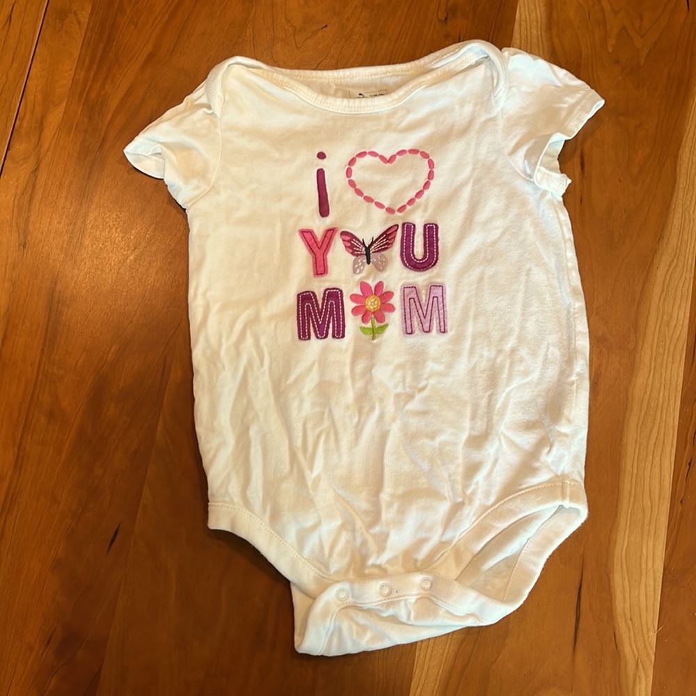 BOGO White onesie with “I love you mom” on front